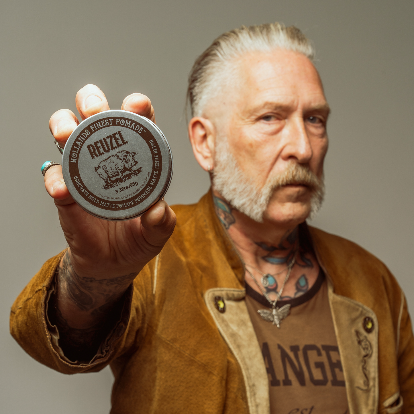 Reuzel Deutschland Concrete Hold Matte Pomade jar with black label and metallic lid, showing the product front view.