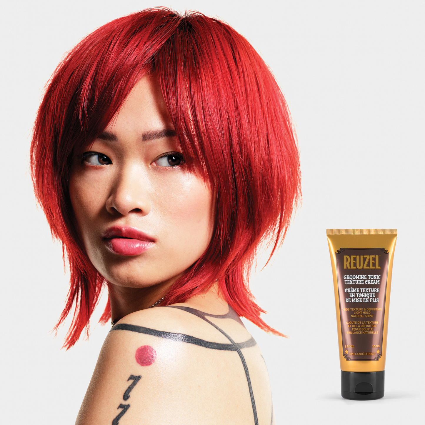 Reuzel Deutschland Grooming Tonic Texture Cream in a jar, showing the hair styling product with a smooth, textured finish
