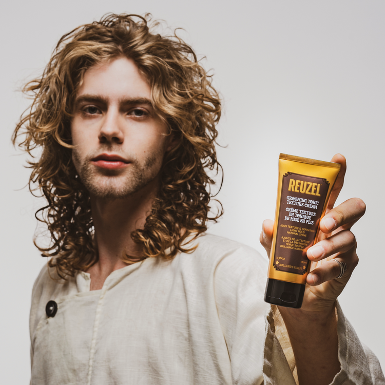 Reuzel Deutschland Grooming Tonic Texture Cream in a jar, showing the cream's smooth, thick texture for hair styling.
