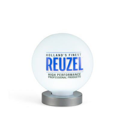 A Reuzel branded illuminated white globe lamp on a metallic silver base, set against a clean white background.
