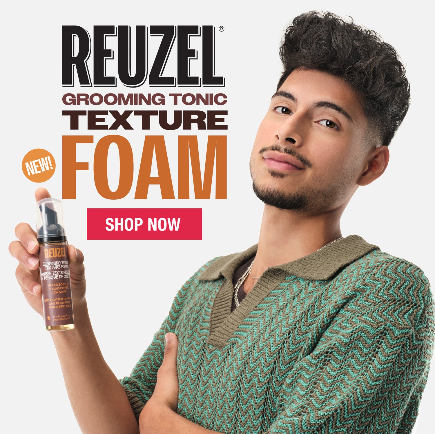 Advertisement for Reuzel Grooming Tonic Texture Foam featuring two models and product packaging.