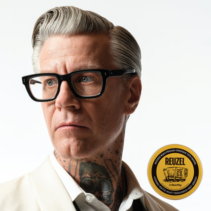 Reuzel Deutschland Severed Head Pomade bottle with Liquid Death branding, showcasing a black and red design on a white background.