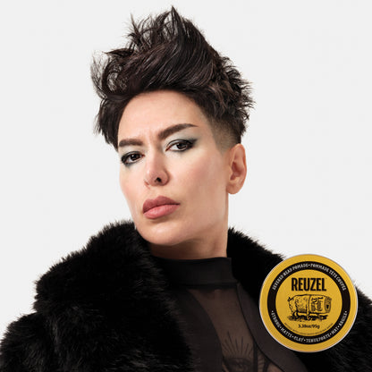 Reuzel Deutschland Severed Head Pomade jar with branding and label, showcasing the product's packaging and design.