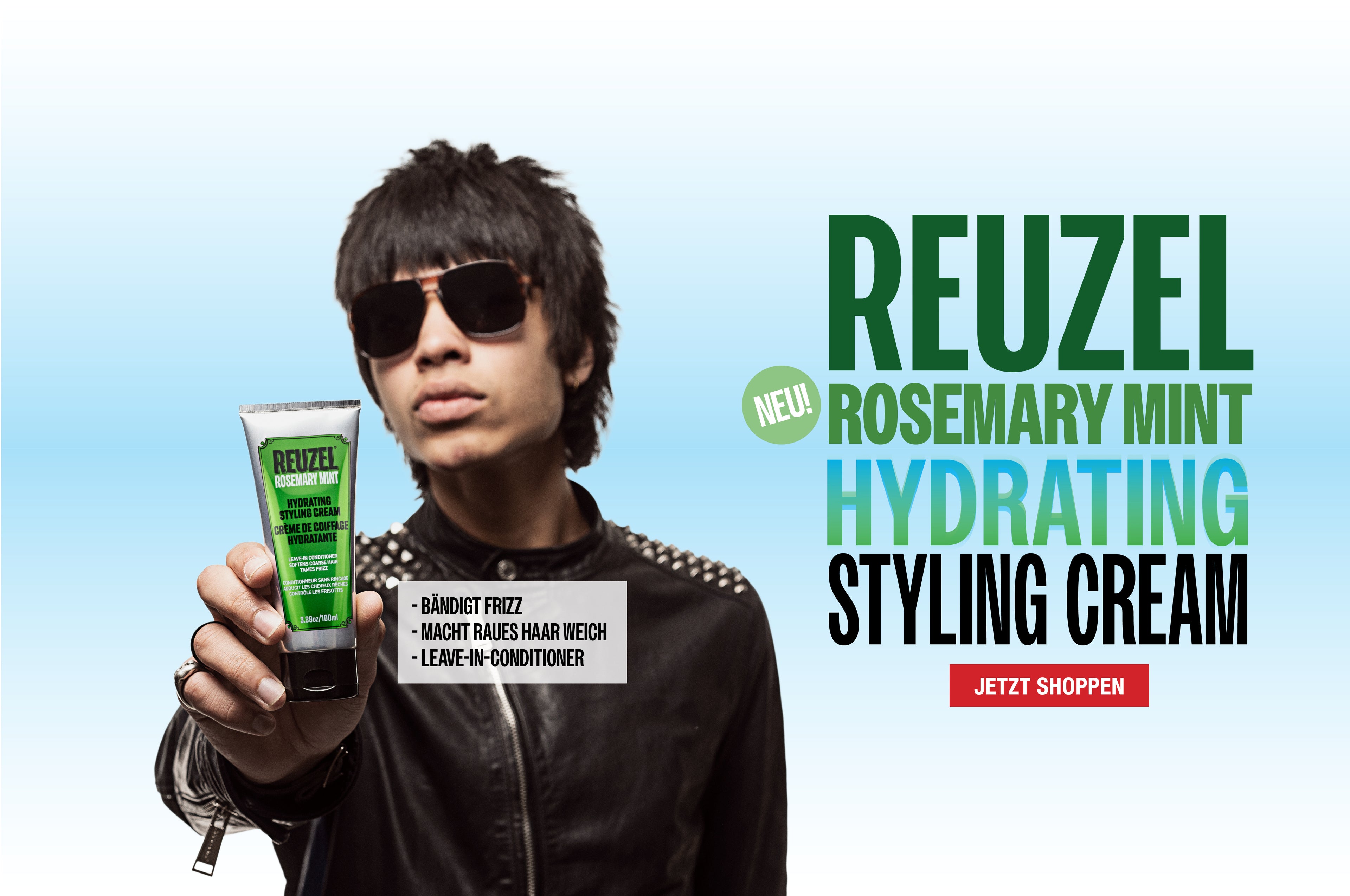 Person holding Reuzel Rosemary Mint Hydrating Styling Cream with brand text on a light blue background