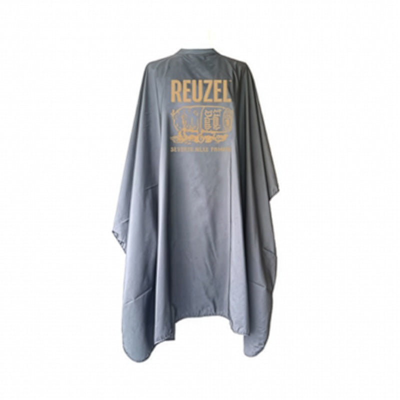Reuzel UK barber cape featuring a graphic severed head design, made for professional grooming and barber shop use.