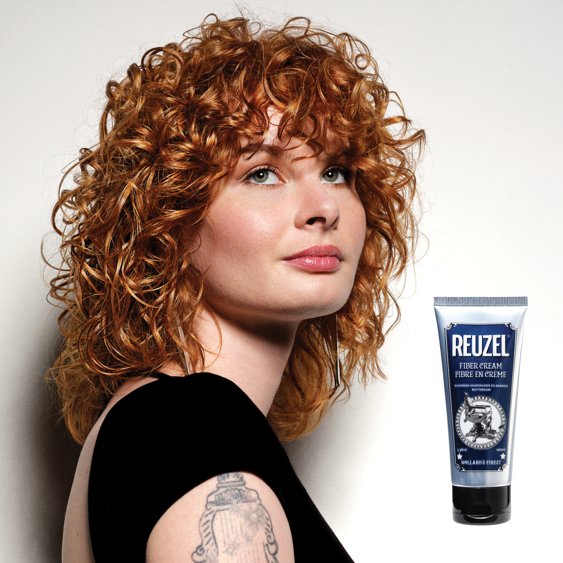 Reuzel Deutschland Fiber Cream hair styling product in a jar, showing its thick, fiber-rich formula for textured hairstyles.
