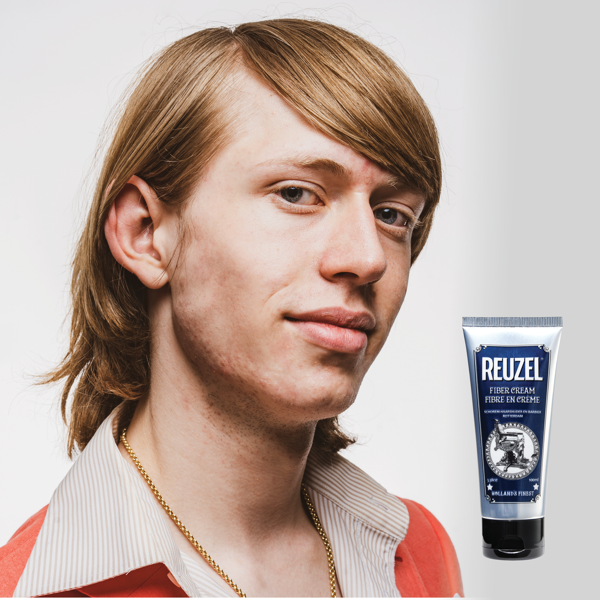 Reuzel Deutschland Fiber Cream for hair styling, showing a jar with cream texture and branding on the label.