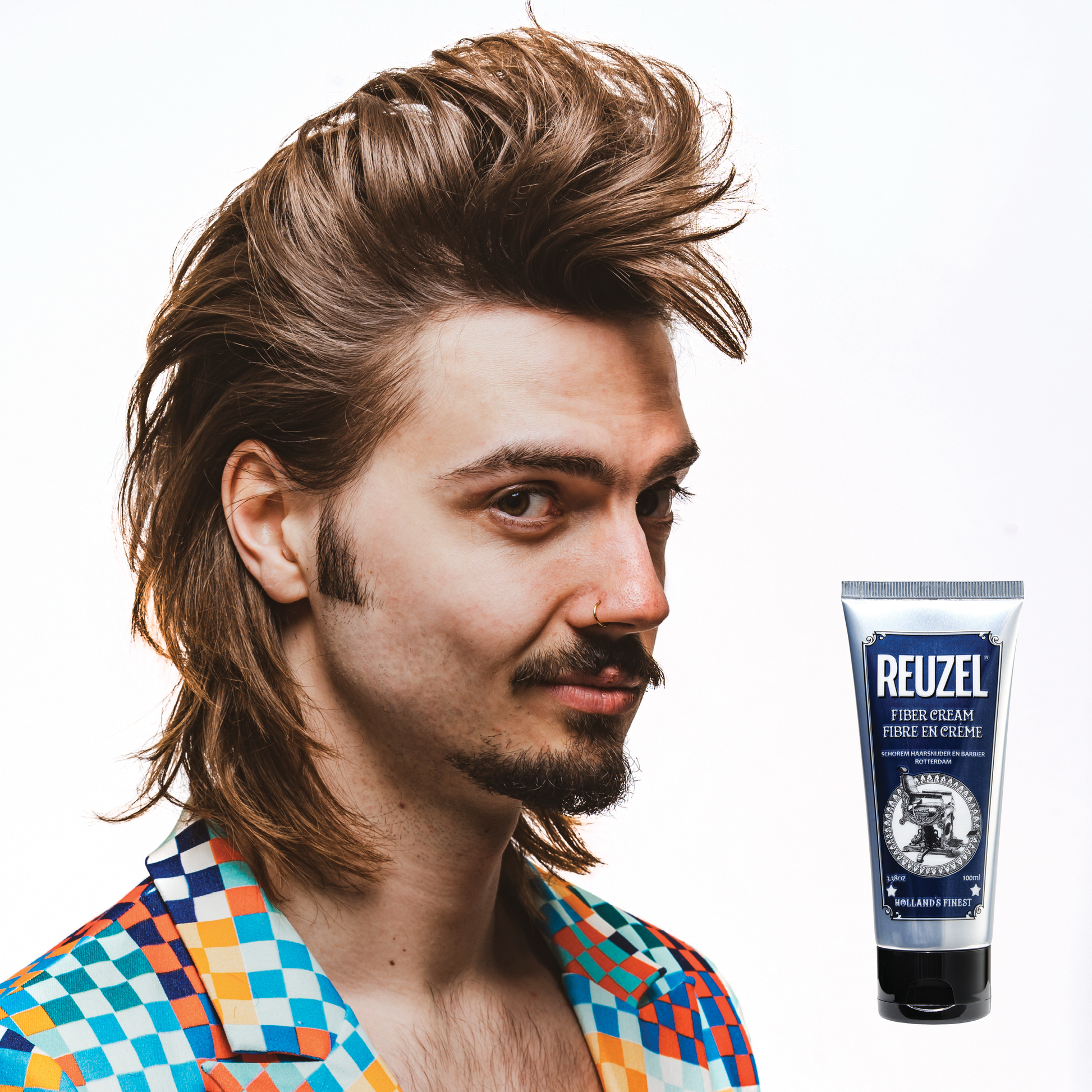 Reuzel Deutschland Fiber Cream hair styling product in a jar, showing the creamy texture and packaging for textured, flexible hair hold