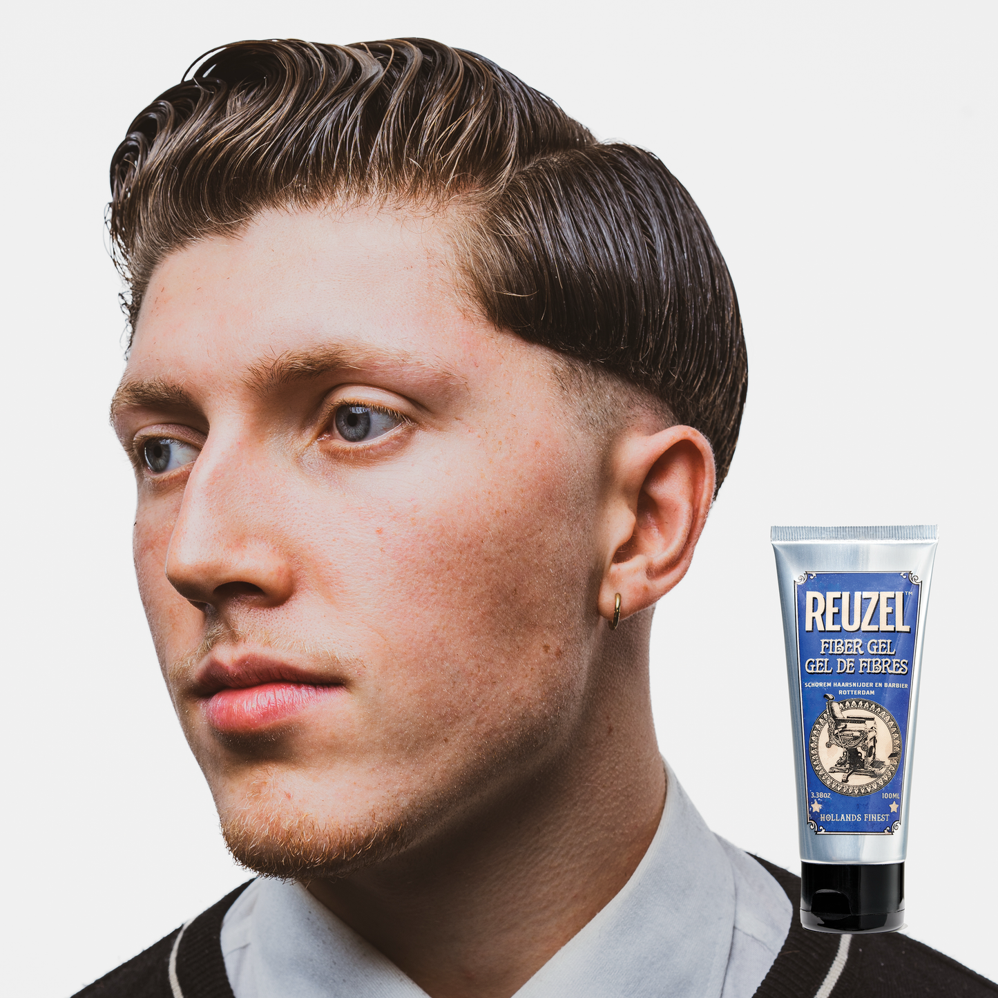 Reuzel Deutschland Fiber Gel for hair styling, showing a jar of thick gel with a professional label and styling texture.