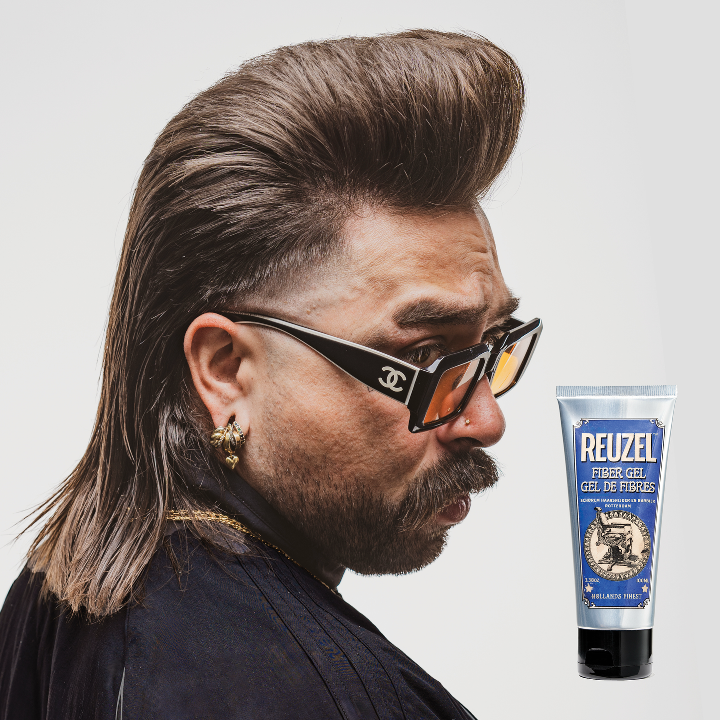 Reuzel Deutschland Fiber Gel for hair styling, showing a close-up of the gel's texture and packaging in a sleek container.