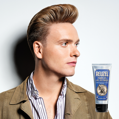 Reuzel Deutschland Fiber Gel hair styling product in a clear jar with white lid, showcasing its thick gel texture.