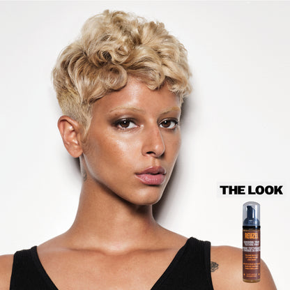 Reuzel Deutschland Grooming Tonic Texture Foam for hair styling, showcasing the foam's lightweight, volumizing texture in a pump bottle.