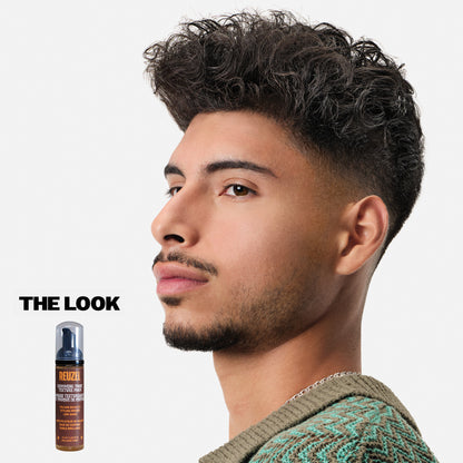 Reuzel Deutschland Grooming Tonic Texture Foam for hair styling, showing the foam in a clear container with a modern design.