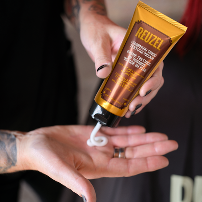 Reuzel Deutschland Grooming Tonic Texture Cream for styling hair, showing the jar with cream inside and product label.