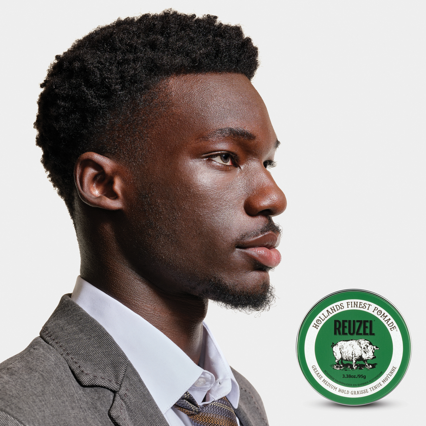 Reuzel Green Pomade jar with green label and lid, showcasing the classic styling product for hair styling and hold.