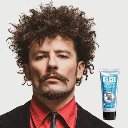 Reuzel Deutschland grooming cream for hair styling, showing the product container with a black lid and label on a plain background.