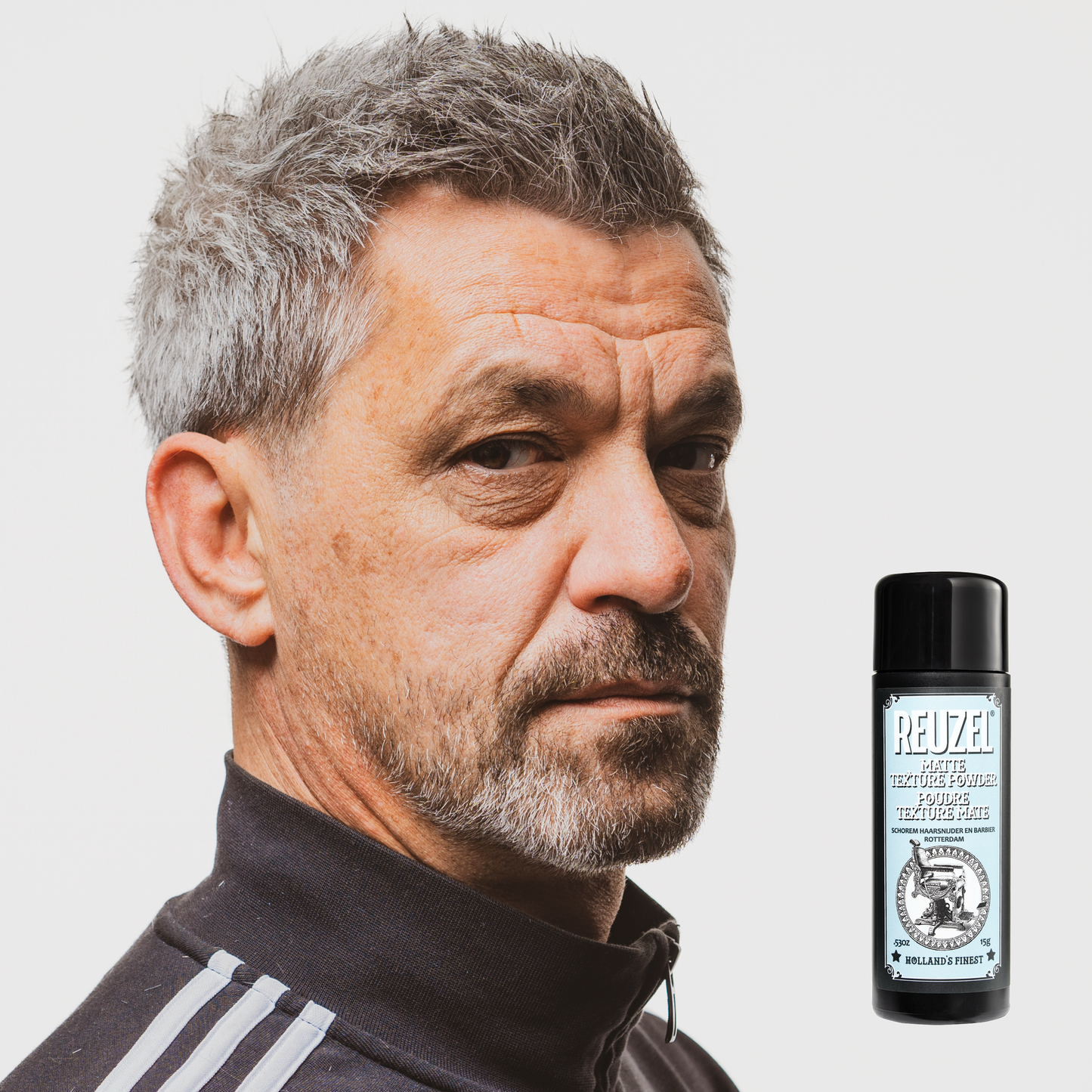 Reuzel Deutschland matte texture powder for hair styling, showing the product container with a matte finish and textured label.