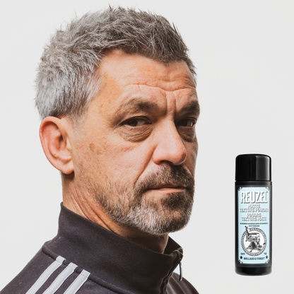 Reuzel Deutschland matte texture powder for hair styling, showing the product container with a matte finish and textured label.