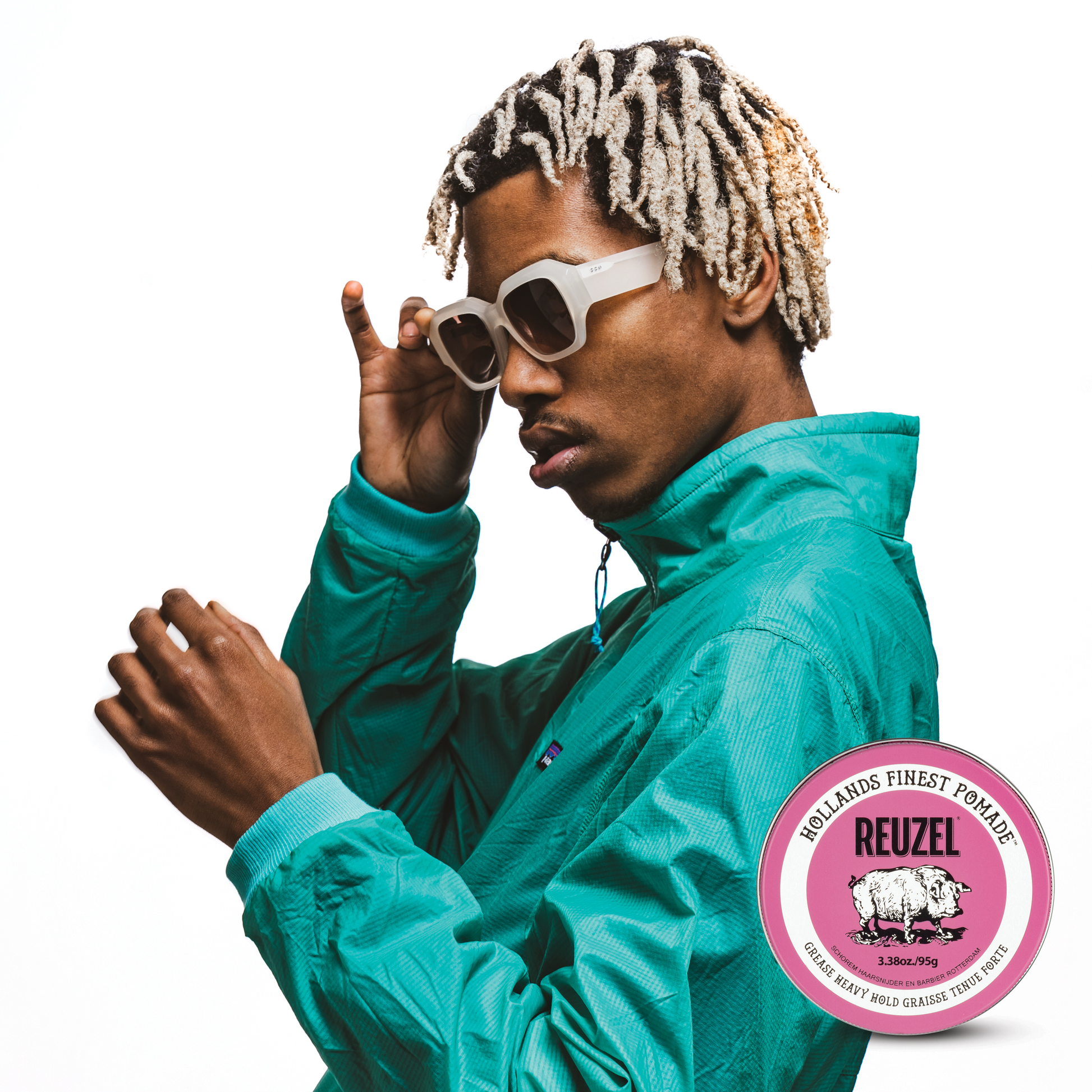 Reuzel Pink Pomade jar with pink lid and label, showcasing the styling product for hair grooming and hold.