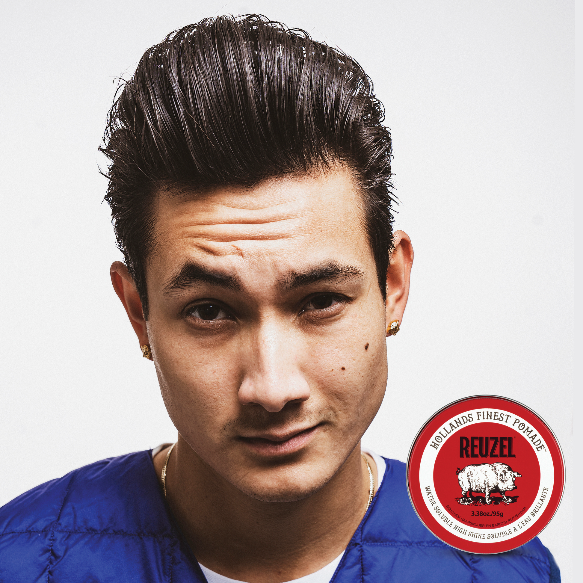 Reuzel Red Pomade in a jar, showcasing the classic red label, ideal for styling hair with a shiny, firm hold.