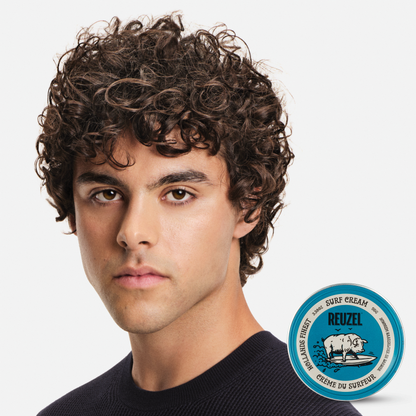Reuzel Deutschland Surf Cream pomade jar with product label, showcasing the styling pomade for textured, beachy hair looks.
