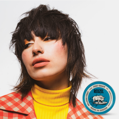 Reuzel Deutschland Surf Cream pomade jar with white lid, showing the product label and creamy texture inside the container.