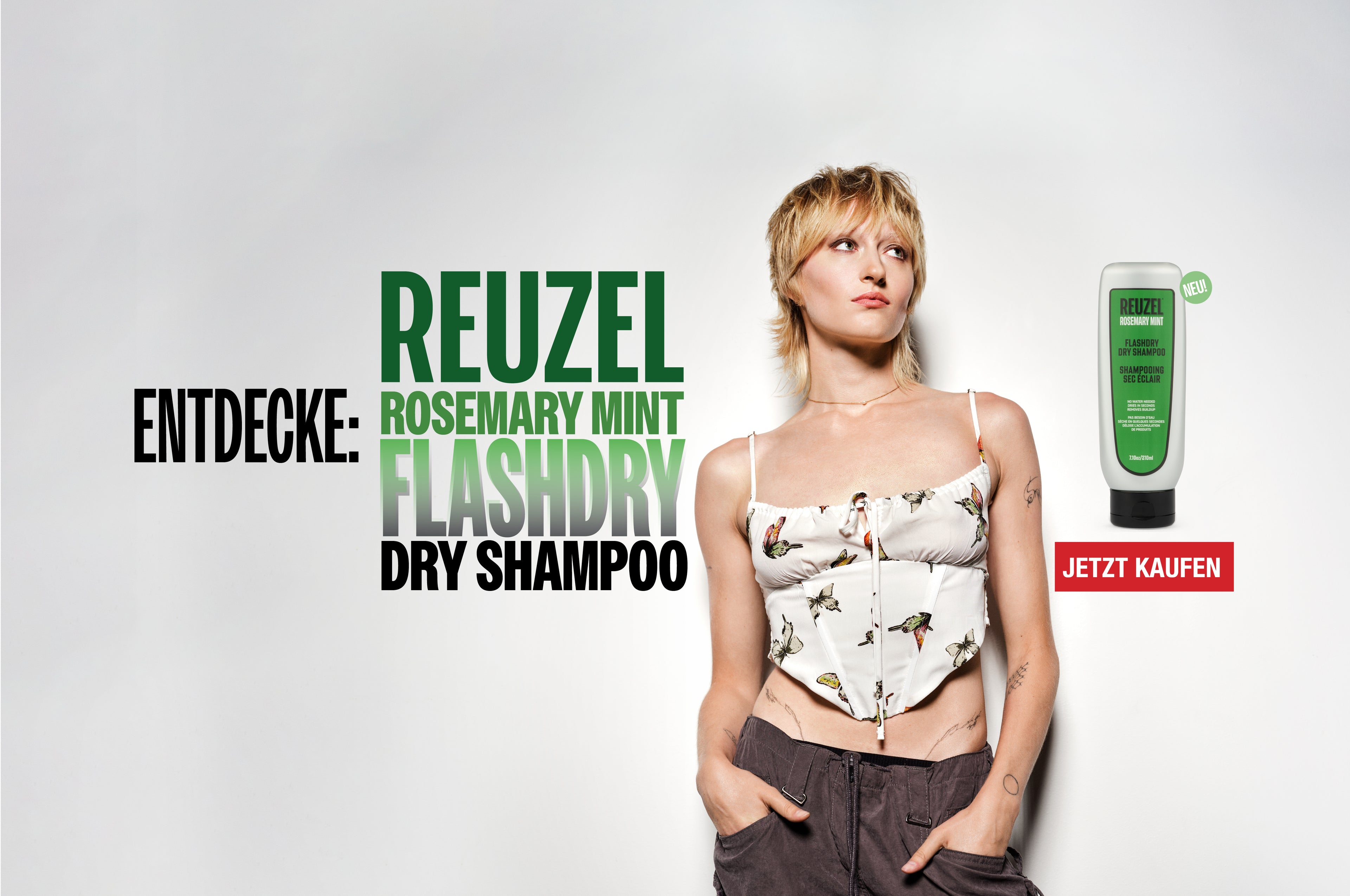 Person the new Reuzel Flashdry Shampoo product on a white background