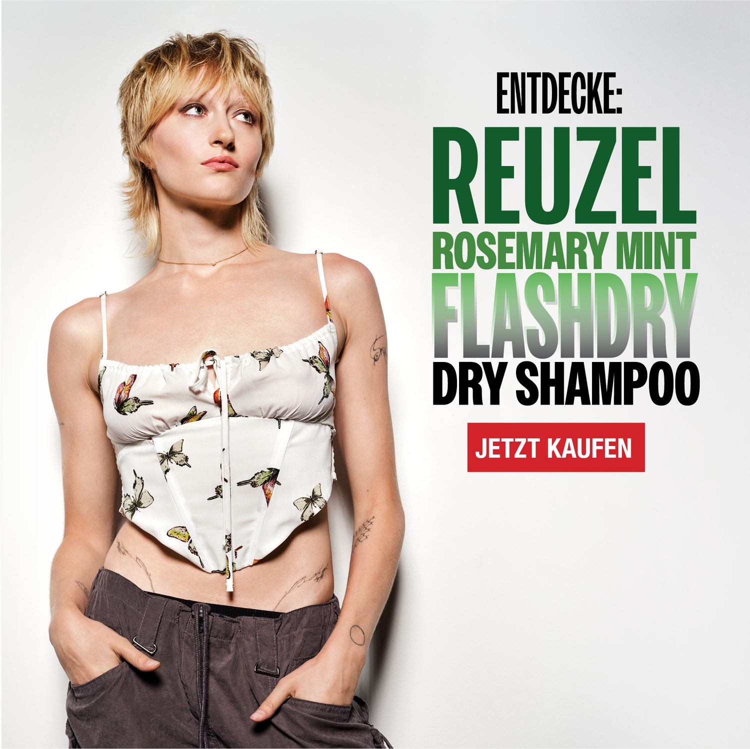 Person the new Reuzel Flashdry Shampoo product on a white background