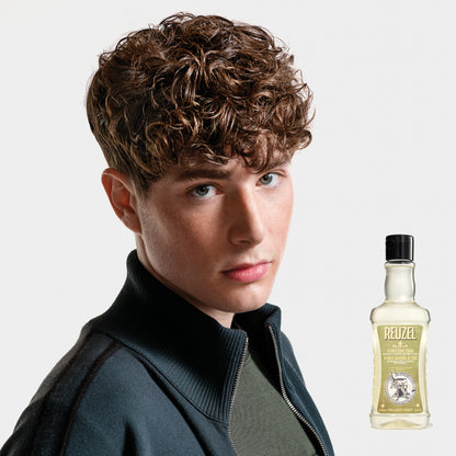 Reuzel Deutschland 3-in-1 tea tree shampoo, conditioner, and body wash bottle with label and pump dispenser.