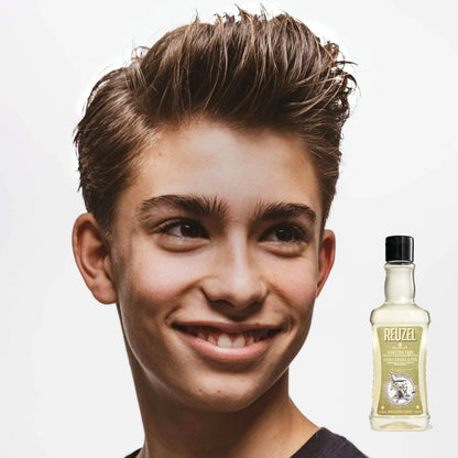 Reuzel Deutschland 3-in-1 Tea Tree shampoo, conditioner, and body wash bottle with label and pump dispenser.