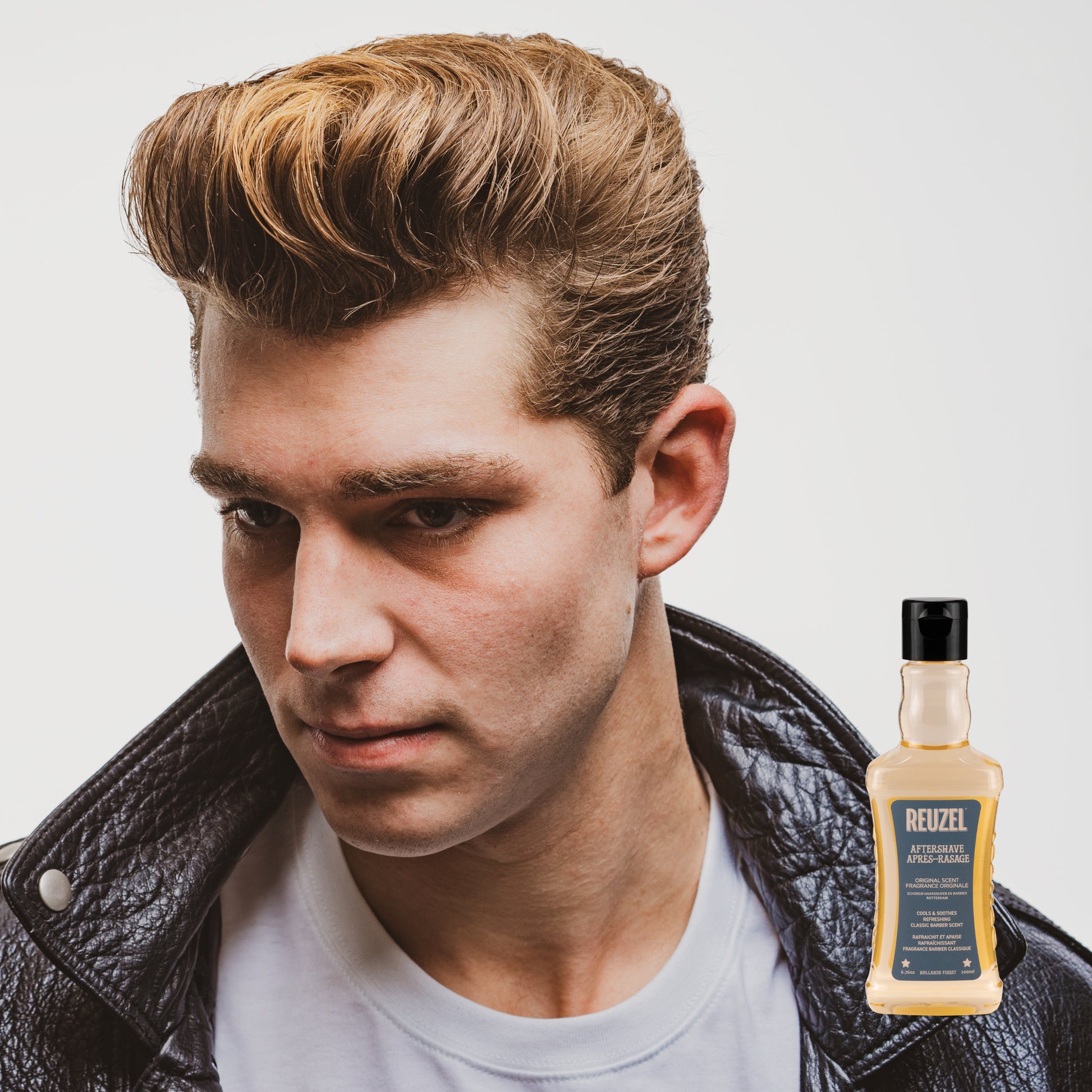 Reuzel Deutschland Reuzel Aftershave bottle with label, featuring a classic design and a dark-colored cap.