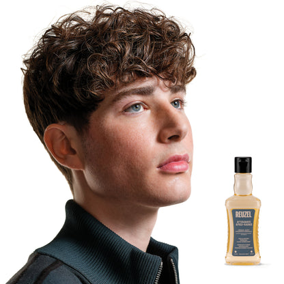 Reuzel Deutschland aftershave bottle with label, showcasing its perfume and cologne scent in a sleek design.