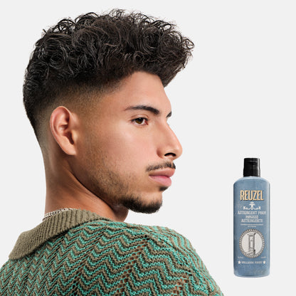 Reuzel Deutschland beard astringent foam in a pump bottle, designed for refreshing and tightening facial skin.