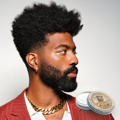 Reuzel Deutschland Wood & Spice Beard Balm in a tin, featuring natural ingredients for grooming and conditioning a beard.