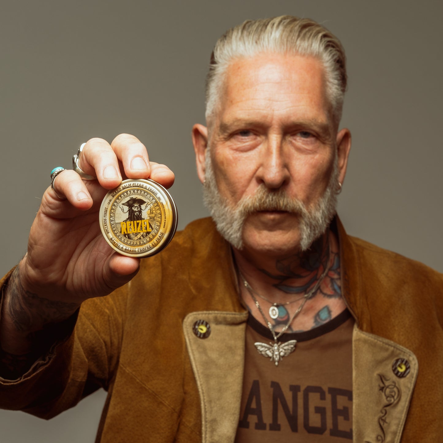 Reuzel Deutschland Wood & Spice Beard Balm in a jar, showing a natural wood and spice scent for beard grooming and conditioning.