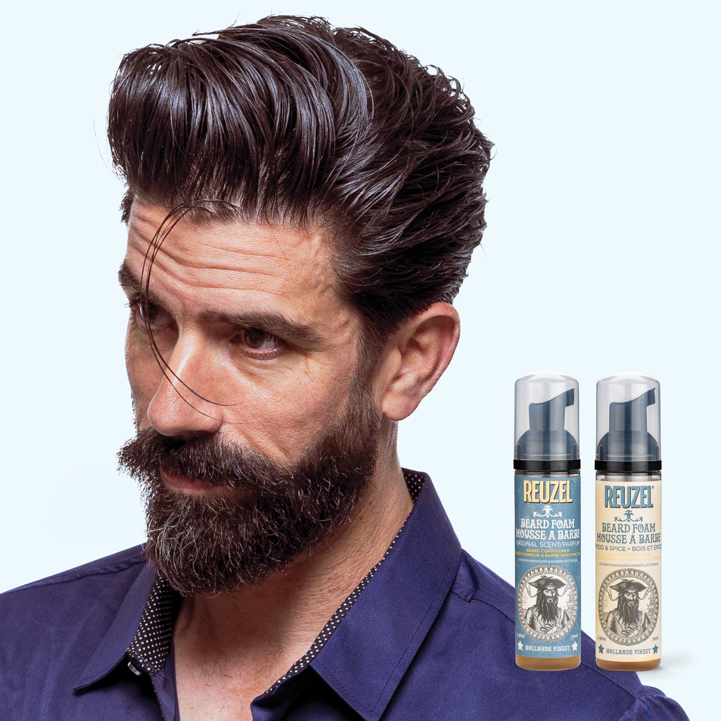 Reuzel Deutschland beard foam in a pump bottle, showing the foam texture and product label for beard grooming.