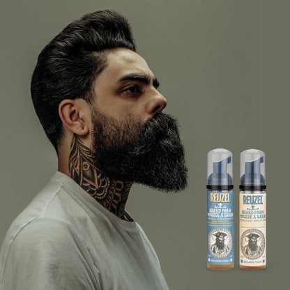 Reuzel Deutschland beard foam in a clear bottle with a pump dispenser, designed for grooming and softening facial hair.