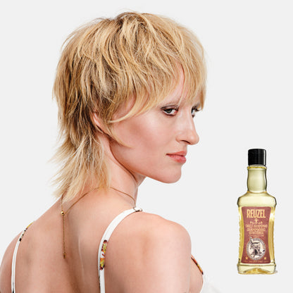 Reuzel Deutschland Daily Shampoo bottle with white label and black cap, displayed on a plain background.