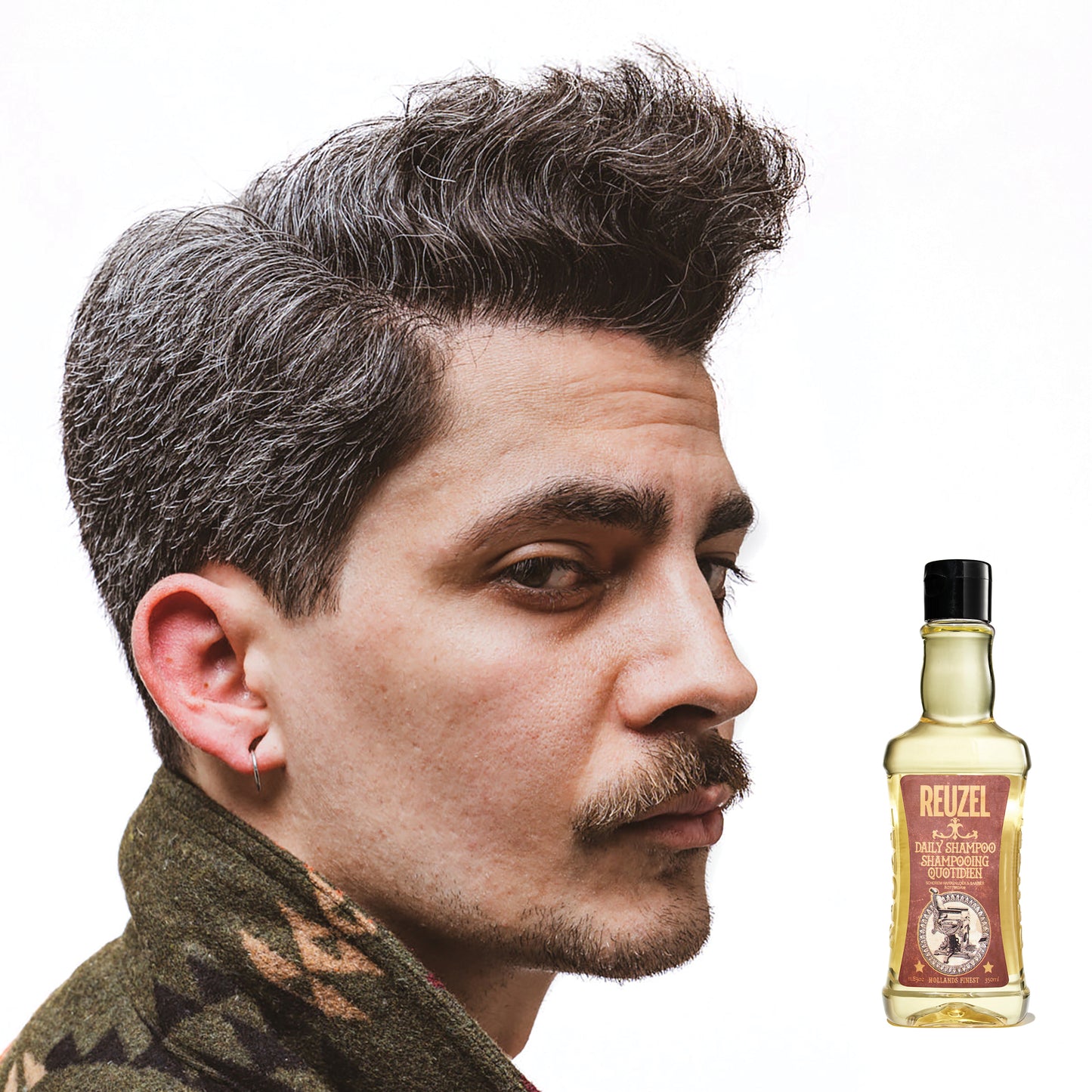 Reuzel Deutschland Daily Shampoo in a clear bottle with a black pump, designed for cleansing hair and scalp.