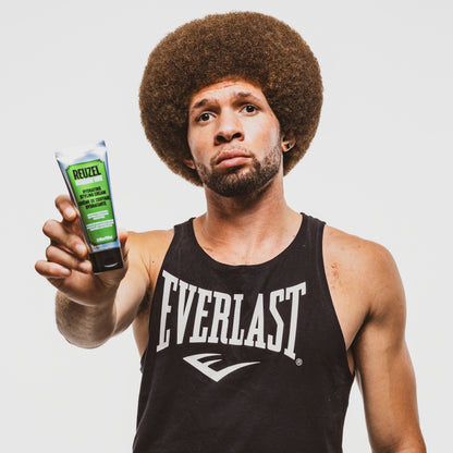 Reuzel Deutschland Hydrating Styling Cream for hair, showing a tube of styling cream with a smooth, creamy texture.