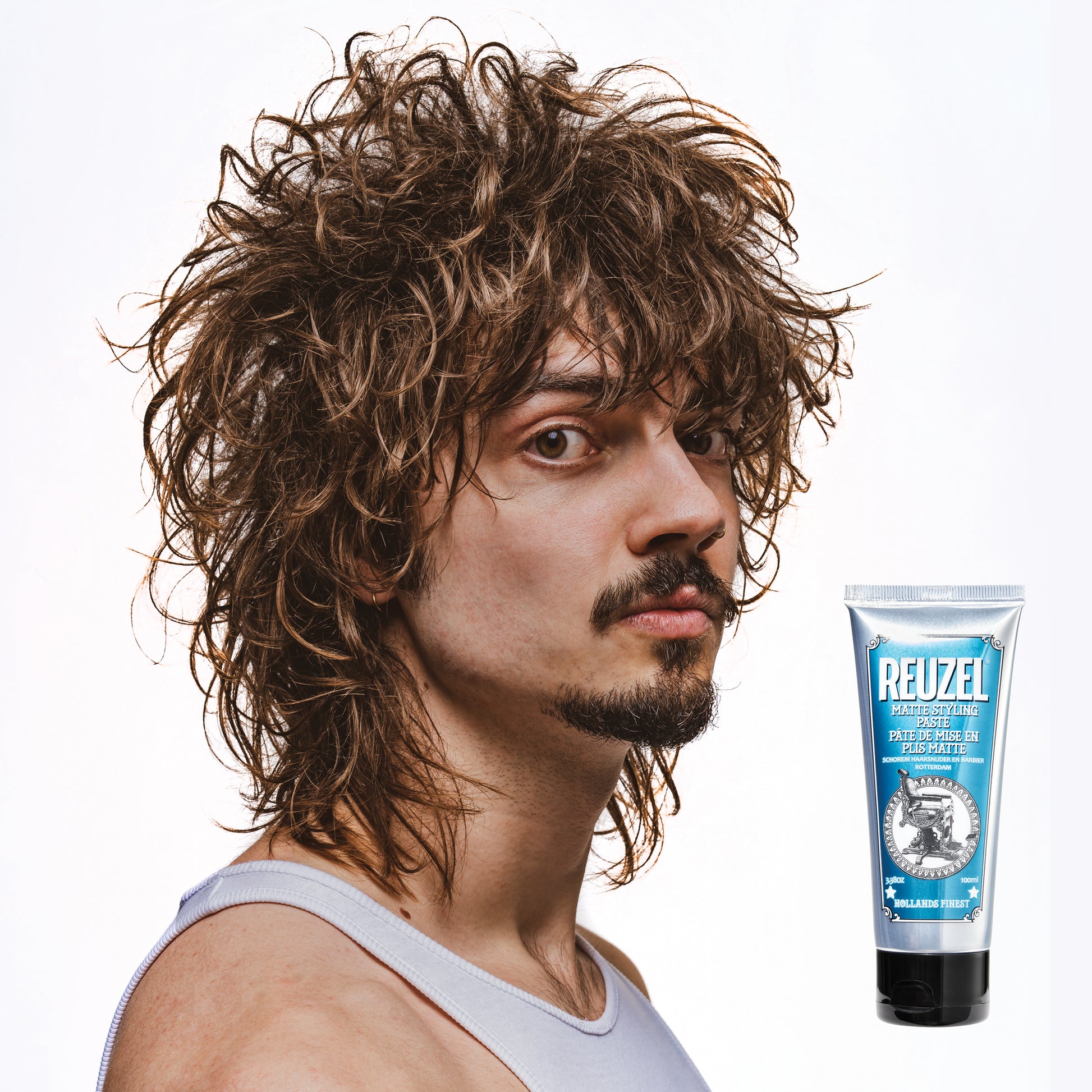 Reuzel Deutschland matte styling paste in a jar, showing the creamy hair styling product with a smooth, matte finish.