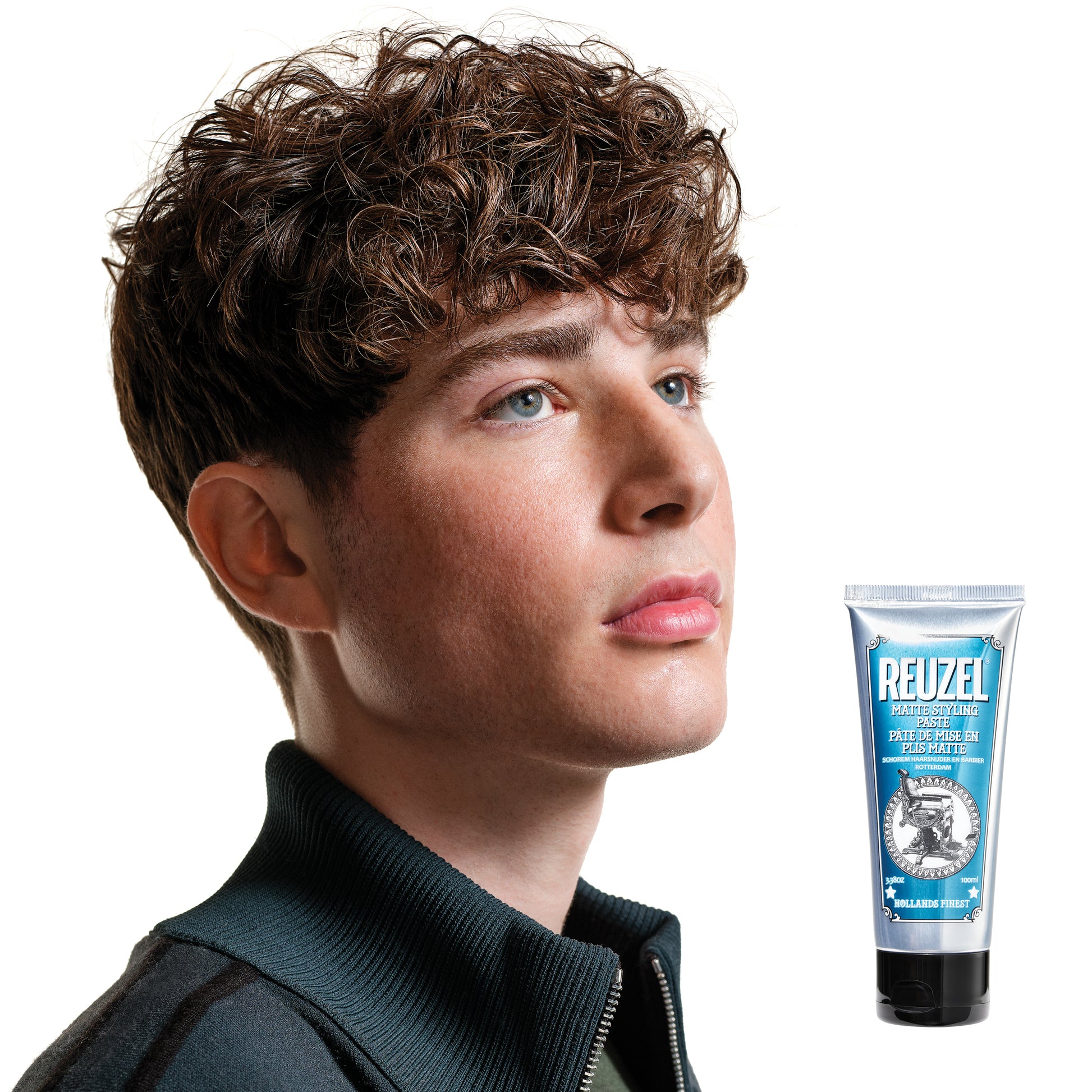 Reuzel Deutschland matte styling paste in a jar, showing thick, matte-textured hair styling product for textured hold and finish.
