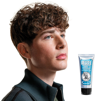 Reuzel Deutschland matte styling paste in a jar, showing thick, matte-textured hair styling product for textured hold and finish.
