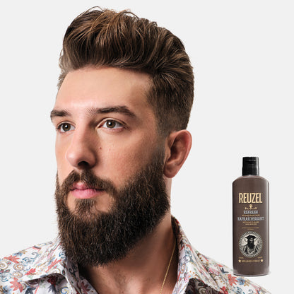 Reuzel Deutschland Refresh No Rinse Beard Wash in a clear bottle with pump for clean, fresh beard grooming.