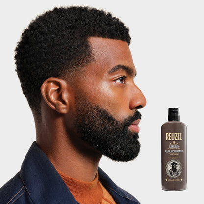 Reuzel Deutschland Refresh No Rinse Beard Wash in a bottle, designed for cleansing and refreshing beards.