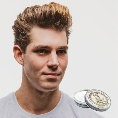 Reuzel Deutschland shave cream in a jar, showcasing smooth, creamy texture ideal for beard grooming and shaving.