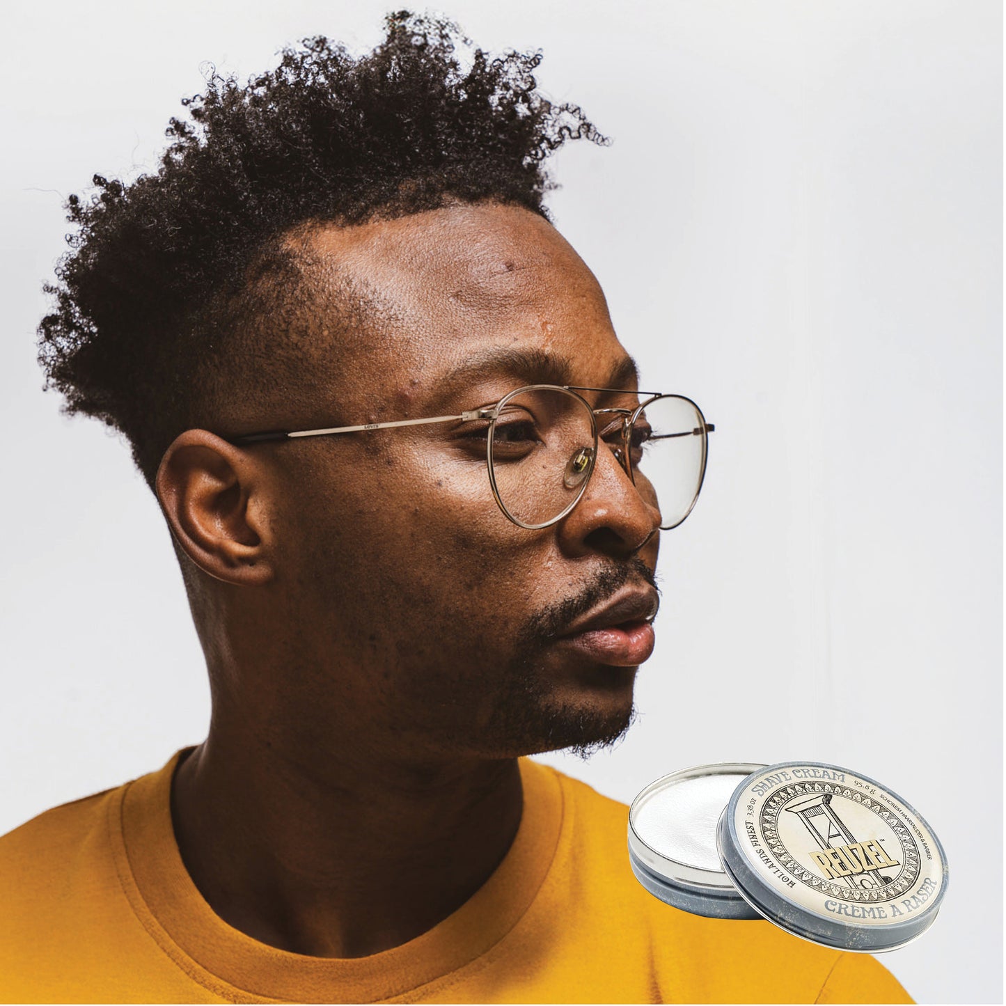 Reuzel Deutschland beard shave cream in a jar, showing smooth cream texture and packaging for men's grooming.