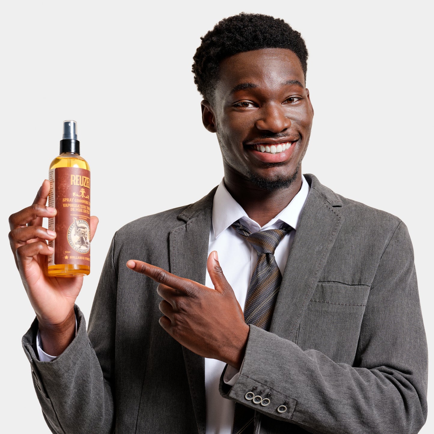 Reuzel Deutschland Spray Grooming Tonic in a spray bottle, designed for hair care and styling.