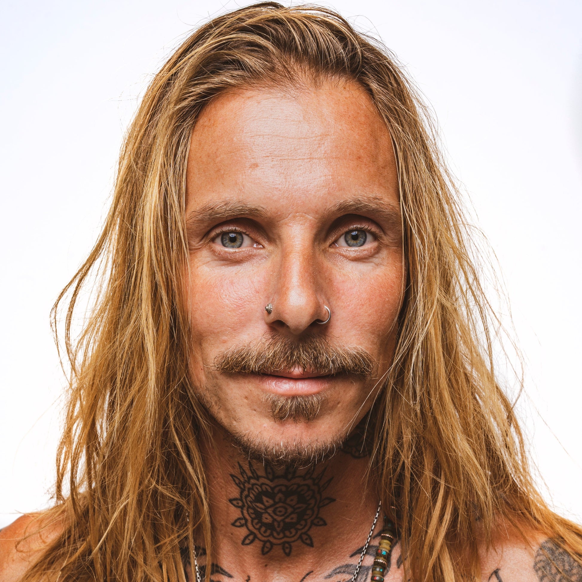 Reuzel Surf Tonic salt spray hair tonic in a clear spray bottle, designed to add texture and volume to hair.