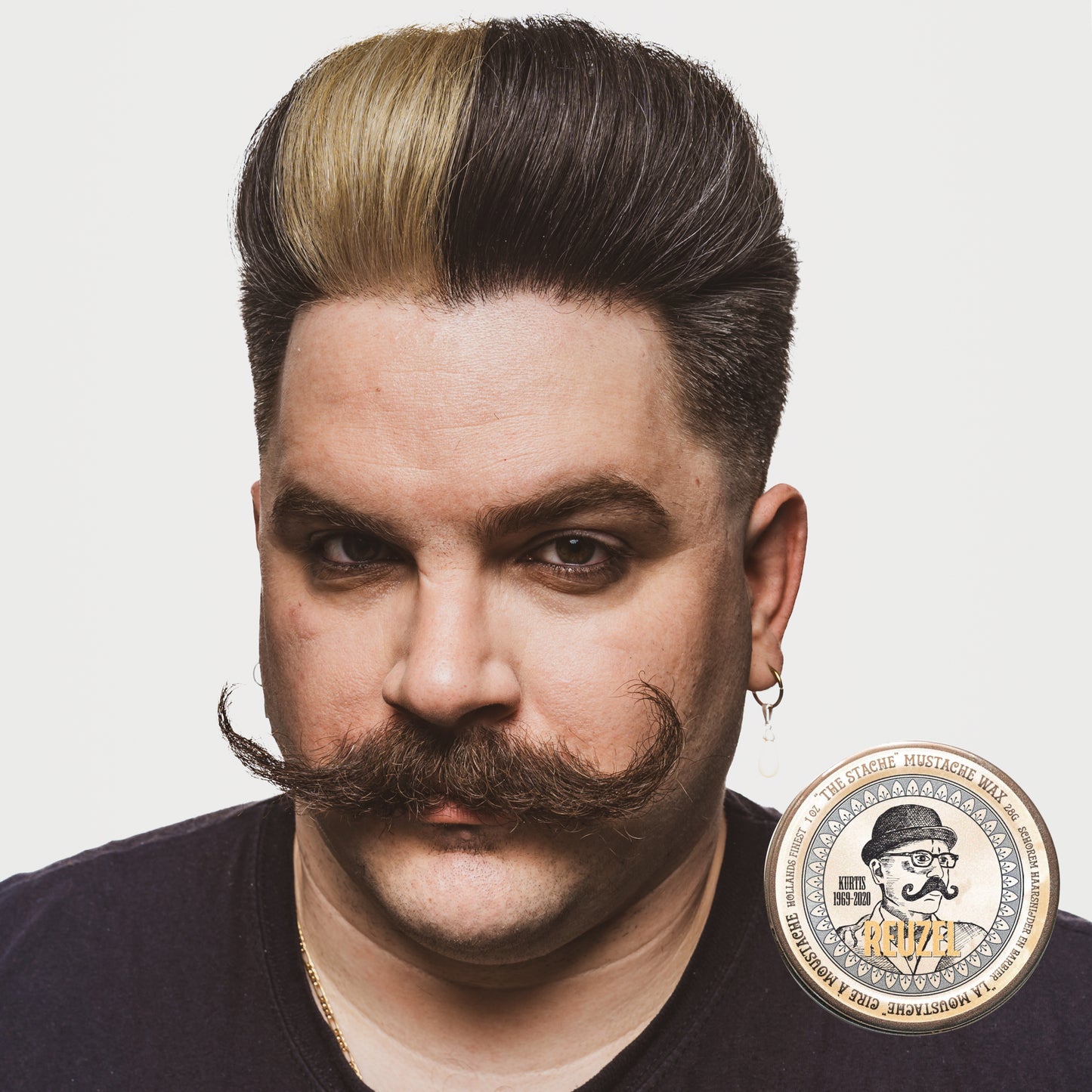 Reuzel Deutschland The Stache Mustache Wax jar with label, designed for shaping and styling mustaches and facial hair.